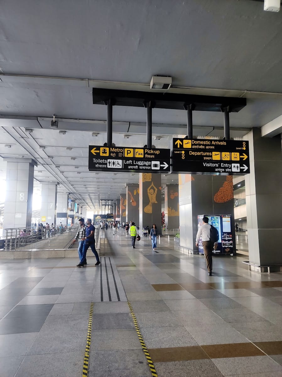 A group of people walking through an airport