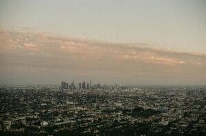 City skyline at dusk with hazy clouds